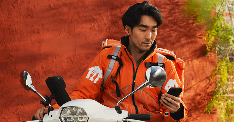 guy delivering for just eat on motorbike